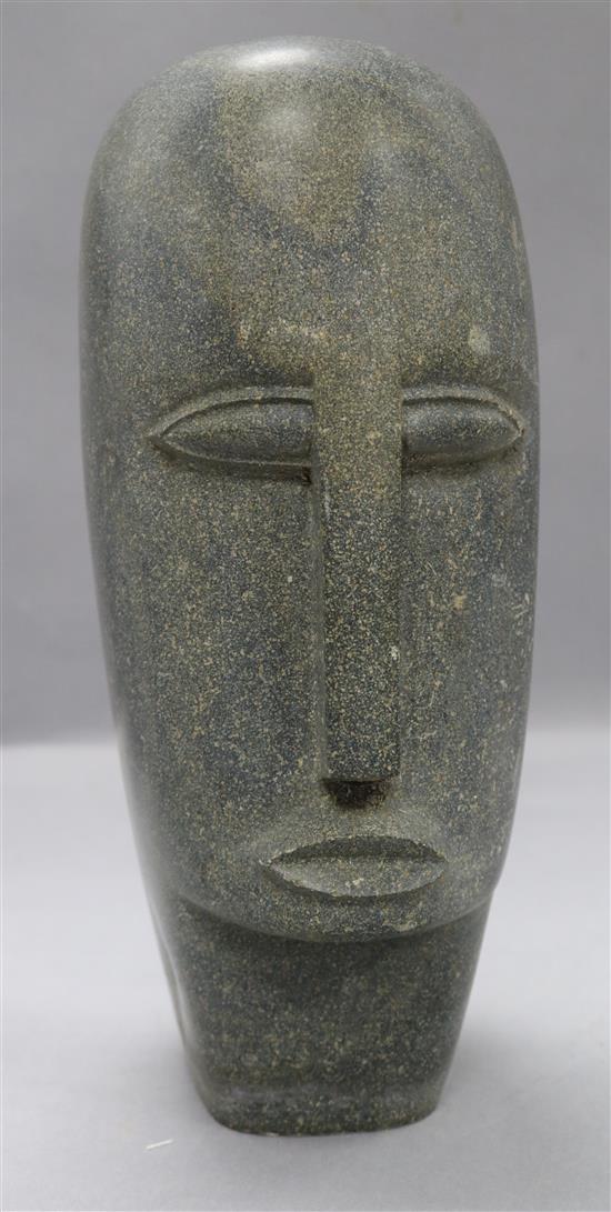 A stoneware carved head height 33cm